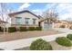Charming single story home with gray exterior, low maintenance landscaping, and mature shade tree at 21716 E Waverly Dr, Queen Creek, AZ 85142