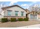 Charming single story home with gray exterior, low maintenance landscaping, and mature shade tree at 21716 E Waverly Dr, Queen Creek, AZ 85142