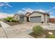 Charming single-story home with a three car garage and stone accents at 21716 E Waverly Dr, Queen Creek, AZ 85142