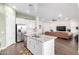 Spacious kitchen featuring an island with granite countertops, stainless steel appliances, and an open layout at 21716 E Waverly Dr, Queen Creek, AZ 85142