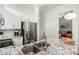 Stylish kitchen with stainless steel appliances, granite countertops, and a view into the bedroom at 21716 E Waverly Dr, Queen Creek, AZ 85142