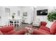 Inviting living room area with a dining table, TV, comfortable chairs, and stylish decor at 21716 E Waverly Dr, Queen Creek, AZ 85142