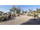 Landscaped backyard with gravel, desert plants, and trees at 24616 S Starcrest Dr, Sun Lakes, AZ 85248