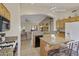 Spacious kitchen featuring granite countertops and an island at 24616 S Starcrest Dr, Sun Lakes, AZ 85248