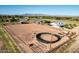 Aerial view of a large property with a house, barn, and riding arena at 2688 E Joy Dr, San Tan Valley, AZ 85140