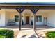 Covered front porch with rustic wooden beams and a bench at 2688 E Joy Dr, San Tan Valley, AZ 85140