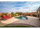 Inviting backyard pool with lounge chairs at 26916 W Potter Dr, Buckeye, AZ 85396