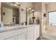 Bathroom includes dual sinks with white granite countertops, and mirrors, and a soaking tub at 2715 W Calle Del Norte Dr, Chandler, AZ 85224