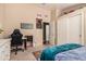 Bedroom featuring a closet, a bed, and a gaming chair at 2715 W Calle Del Norte Dr, Chandler, AZ 85224