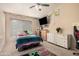 Bedroom features a window, a bed, and a ceiling fan at 2715 W Calle Del Norte Dr, Chandler, AZ 85224