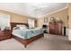 Bright bedroom features a king size bed, carpeted floors, and and matching nightstands at 2715 W Calle Del Norte Dr, Chandler, AZ 85224