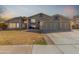 Well-maintained two-story home with three-car garage and manicured lawn, offering great curb appeal at 2715 W Calle Del Norte Dr, Chandler, AZ 85224