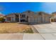 Charming single-Gathering home features a well-manicured lawn, three-car garage, and a welcoming facade at 2715 W Calle Del Norte Dr, Chandler, AZ 85224