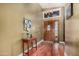 Welcoming foyer featuring hardwood floors, an elegant chandelier, and a solid wood front door at 2715 W Calle Del Norte Dr, Chandler, AZ 85224