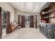 Bright and airy living room with large bay window, neutral carpet, and elegant built-in shelving for storage and display at 2715 W Calle Del Norte Dr, Chandler, AZ 85224