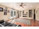 Bright living room boasts hardwood floors, built-in shelves, and a ceiling fan at 2715 W Calle Del Norte Dr, Chandler, AZ 85224
