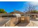Gourmet outdoor kitchen with stainless steel appliances, granite countertops, and a bar for entertaining at 2715 W Calle Del Norte Dr, Chandler, AZ 85224