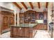 Gourmet kitchen with large island, green countertops, and wood cabinetry at 29 E Oakwood Hills Dr, Chandler, AZ 85248