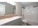 Updated bathroom with gray vanity and white subway tile at 2949 E Willow Ave, Phoenix, AZ 85032