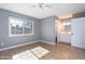 Bright bedroom with wood floors and ensuite bathroom at 2949 E Willow Ave, Phoenix, AZ 85032
