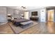 Spacious Primary bedroom with large bed, modern decor, and hardwood floors at 2949 E Willow Ave, Phoenix, AZ 85032