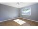Bright bedroom featuring wood-look floors and a large window at 2949 E Willow Ave, Phoenix, AZ 85032