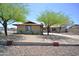 Single-story home with mature shade trees and low-maintenance desert landscaping at 2949 E Willow Ave, Phoenix, AZ 85032
