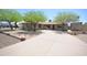 Well-maintained home with mature trees, desert landscaping, and a long driveway at 2949 E Willow Ave, Phoenix, AZ 85032