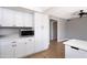 Modern kitchen with white cabinets and stainless steel appliances at 2949 E Willow Ave, Phoenix, AZ 85032
