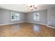 Living room with wood floors, fireplace, and large windows at 2949 E Willow Ave, Phoenix, AZ 85032