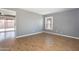 Spacious living room featuring wood floors and large window at 2949 E Willow Ave, Phoenix, AZ 85032