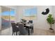 Bright dining area with table and chairs, sliding glass door to backyard at 3089 N 200Th Ave, Buckeye, AZ 85396