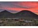 Community view showcasing a clubhouse, pool, and scenic mountain backdrop at 32464 N 134Th Ln, Peoria, AZ 85383