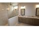 Bathroom featuring granite countertops, and a glass-walled shower at 32464 N 134Th Ln, Peoria, AZ 85383