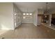 Bright living room with large windows and doors leading to the backyard at 32464 N 134Th Ln, Peoria, AZ 85383