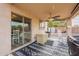Covered patio with ceiling fan and access to backyard at 32504 N Cherry Creek Rd, San Tan Valley, AZ 85144