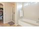 Main bathroom with bathtub, shower, and tile flooring at 32504 N Cherry Creek Rd, San Tan Valley, AZ 85144