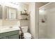 Small bathroom with a shower, toilet, and a floating shelf at 32504 N Cherry Creek Rd, San Tan Valley, AZ 85144
