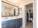 Bathroom boasts double vanity, large mirror, and access to a walk-in closet at 32504 N Cherry Creek Rd, San Tan Valley, AZ 85144