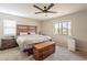 Main bedroom with a wooden headboard and mountain views at 32504 N Cherry Creek Rd, San Tan Valley, AZ 85144
