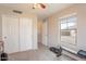 Bedroom with double door closet and window looking out to backyard at 32504 N Cherry Creek Rd, San Tan Valley, AZ 85144