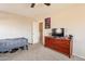 Bedroom featuring a bed, dresser, and TV at 32504 N Cherry Creek Rd, San Tan Valley, AZ 85144