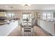 Kitchen dining area with a dark wood table and white chairs at 32504 N Cherry Creek Rd, San Tan Valley, AZ 85144