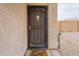 Front door with security screen and welcome mat at 32504 N Cherry Creek Rd, San Tan Valley, AZ 85144