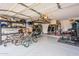 Spacious garage with overhead storage and shelving at 32504 N Cherry Creek Rd, San Tan Valley, AZ 85144