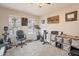 Home office with a treadmill, weights, and ample storage at 32504 N Cherry Creek Rd, San Tan Valley, AZ 85144