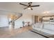 Living room with tile floors, a gray couch, and a view of the kitchen at 32504 N Cherry Creek Rd, San Tan Valley, AZ 85144