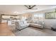 Spacious living room with a large sectional sofa and entertainment center at 32504 N Cherry Creek Rd, San Tan Valley, AZ 85144