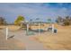 Community playground with shaded seating and play structures at 32504 N Cherry Creek Rd, San Tan Valley, AZ 85144