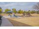 Community playground with shaded seating and play structures at 32504 N Cherry Creek Rd, San Tan Valley, AZ 85144